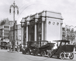 Cabs including Unics, Ranked at Marble Arch facing East towards Oxford Street in London c1920s