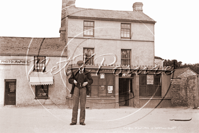 Picture of Cornwall - St Just, Market Square Post Office and man standing in road c1900s - N2676